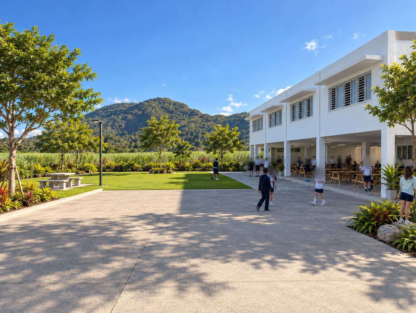 La cour du collège, ouverte sur les champs de canne et la montagne